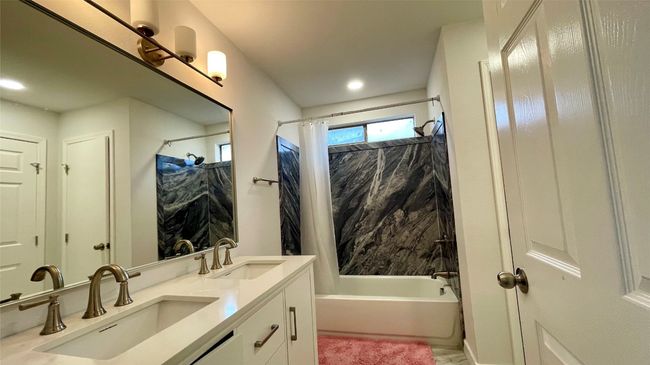 Bathroom with shower / tub combo and double vanity | Image 10