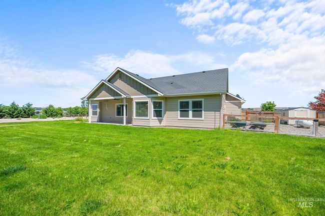 View of front of house with a shingled roof and board and batten siding | Image 40