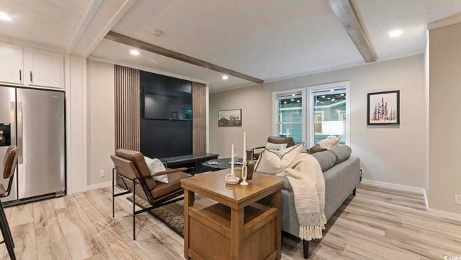 Living room with beamed ceiling, baseboards, recessed lighting, and light wood-style floors | Image 5