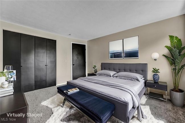 Carpeted bedroom featuring baseboards | Image 15