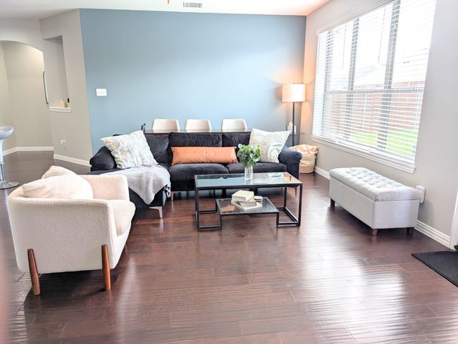Living room featuring arched walkways and dark wood-type flooring | Image 17