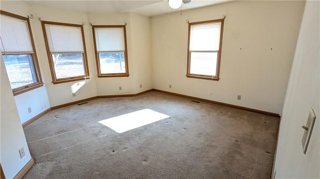 Carpeted empty room with ceiling fan | Image 25