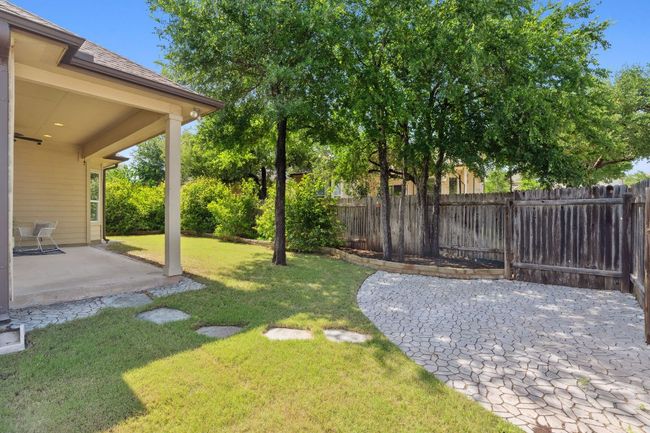 Stepping stones guide you to a paved sunbathing area that could also be used for al fresco dining. | Image 33