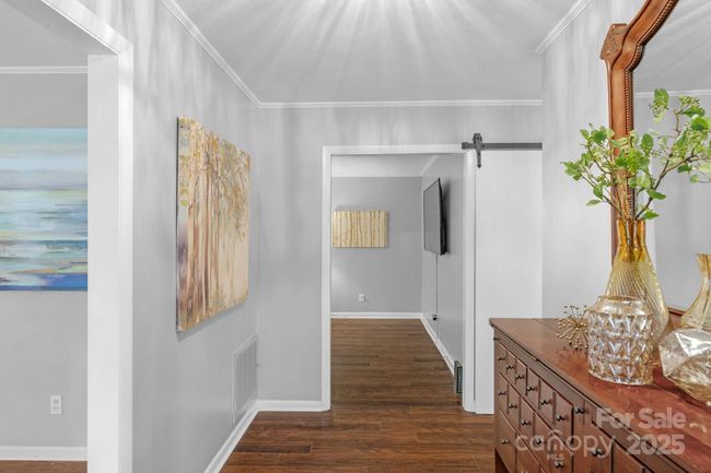Neutral color palette with crown molding and LVP flooring | Image 34