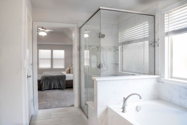 Ensuite bathroom with ensuite bath, a garden tub, a marble finish shower, and a ceiling fan | Image 16