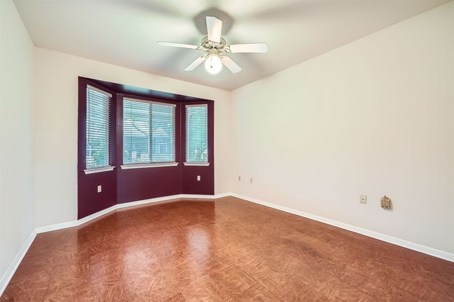 Empty room featuring baseboards and a ceiling fan | Image 21