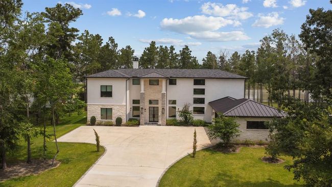 Welcome home! Step into a masterpiece of design and craftsmanship with this breathtaking story estate, perfectly positioned on a scenic lakefront lot. | Image 6
