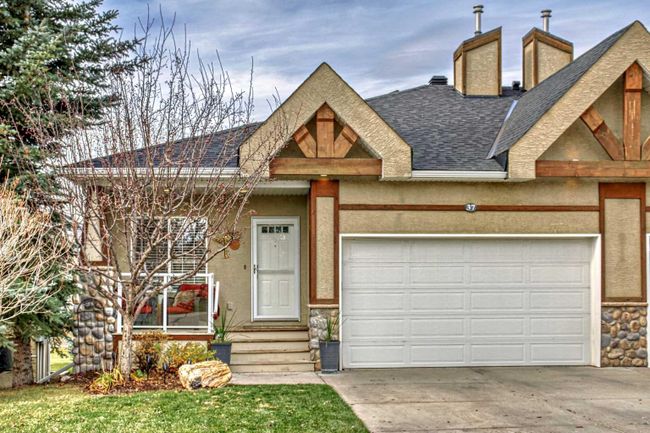 37 Rowland Lane, Home with 3 bedrooms, 2 bathrooms and 2 parking in Okotoks AB | Image 1