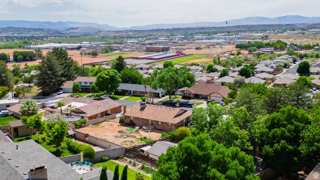 Aerial view of residential area featuring mountains | Image 9