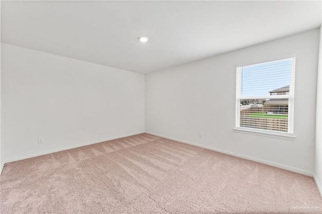 Carpeted empty room featuring baseboards and recessed lighting | Image 23