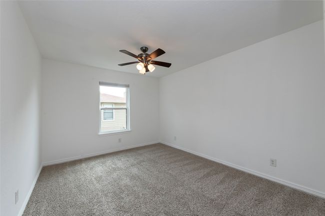 Empty room with baseboards, a ceiling fan, and carpet floors | Image 14