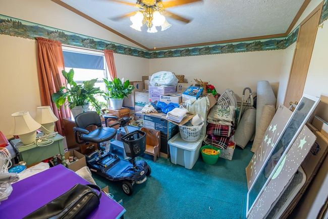 Storage room with ceiling fan | Image 23