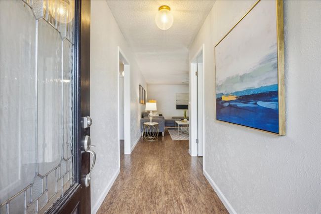 Entrance foyer featuring wood finished floors and baseboards | Image 5