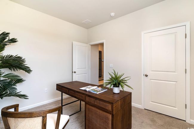 Office space with visible vents, baseboards, and light carpet | Image 21