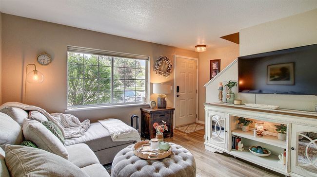 Living area featuring light wood-type flooring and plenty of natural light | Image 11