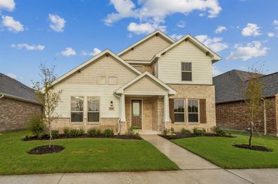 Craftsman inspired home featuring a front yard | Image 1