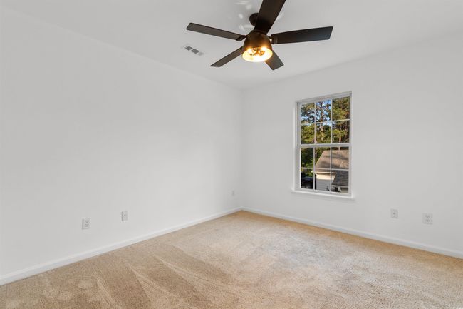 Full bath featuring a stall shower, toilet, and baseboards | Image 17