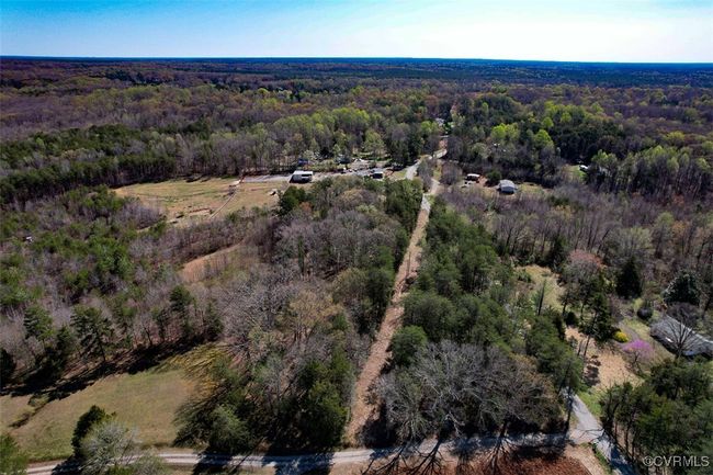 Aerial view featuring a forest view | Image 21