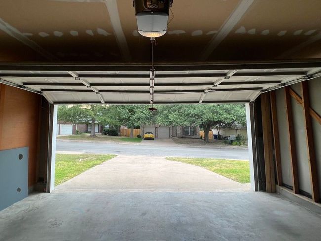 Garage featuring a garage door opener | Image 36