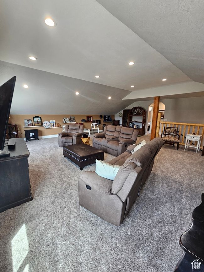 Upstairs living room featuring a healthy amount of sunlight and lofted ceiling | Image 46