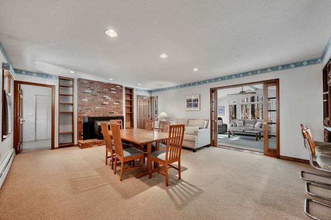 Family/great room with wood stove open to powder room, kitchen, sunroom | Image 9