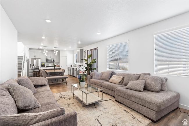 Living area featuring a wealth of natural light, recessed lighting, and light wood-style flooring | Image 6