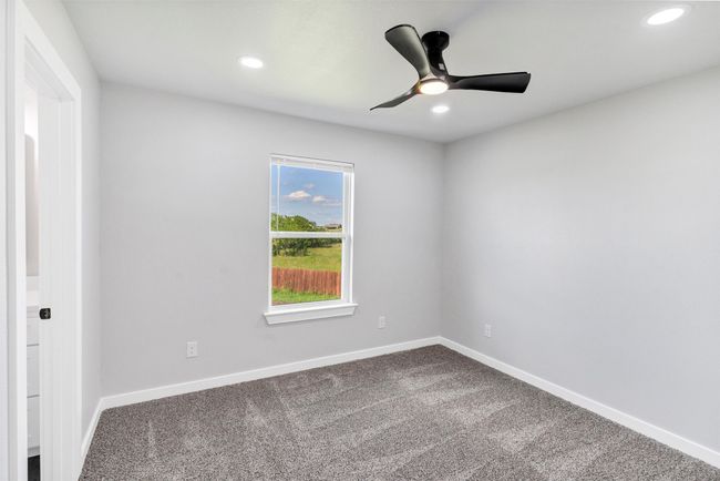 Unfurnished room with ceiling fan, dark carpet, recessed lighting, and baseboards | Image 35