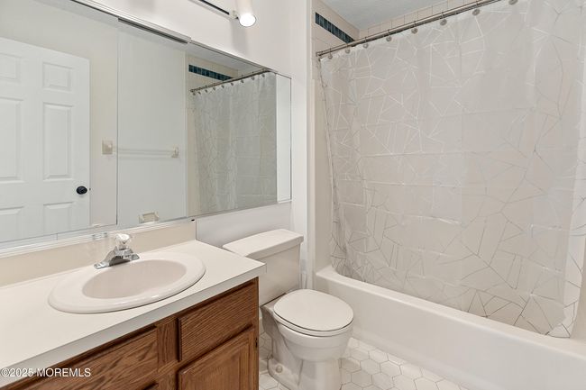 Additional Full Bath offers neutral tile and spacious vanity | Image 18