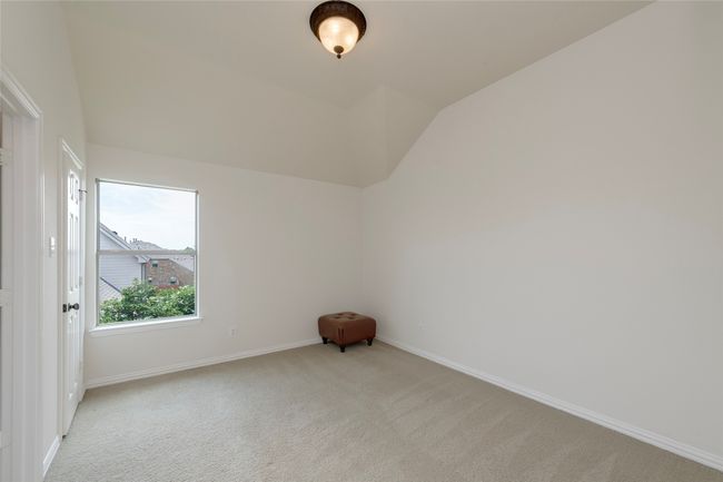 Additional living space with light carpet and vaulted ceiling | Image 33