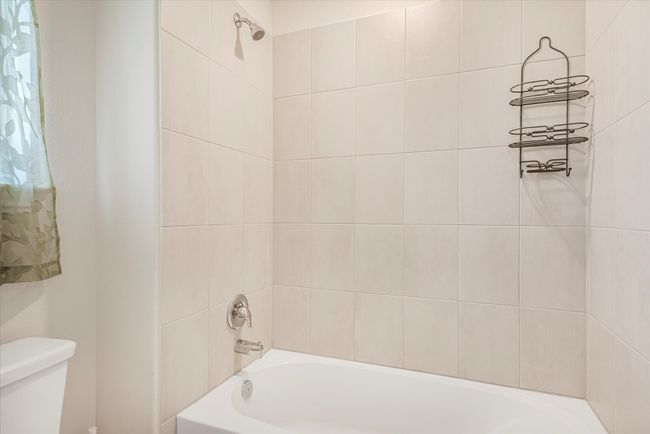 Full bathroom with tub / shower combination and toilet | Image 22