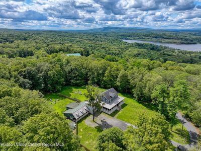 Bird's eye view of property with a glimpe of Stugeon Pool off to the right | Image 1