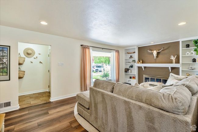 Living room with wood finished floors and recessed lighting | Image 14
