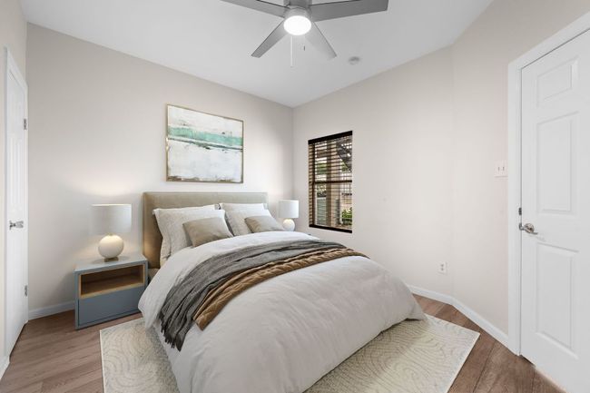 Bedroom featuring wood finished floors, baseboards, and ceiling fan | Image 8