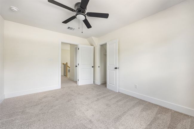 Unfurnished bedroom featuring carpet flooring and a ceiling fan | Image 40