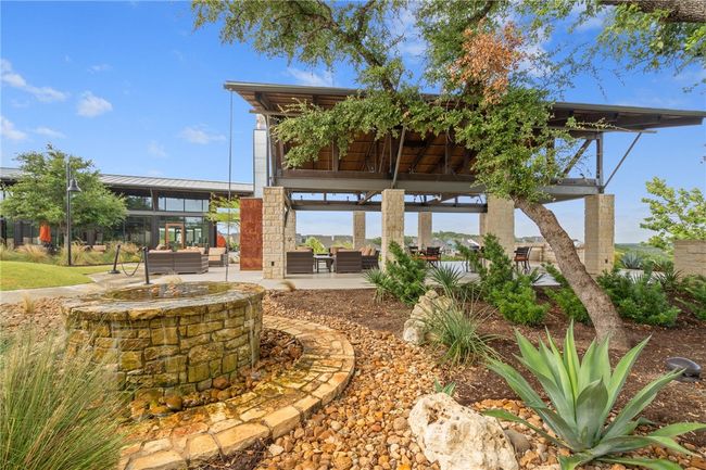 Beautiful amenity center, water fall, lush landscaping and meandering walking trails! | Image 38