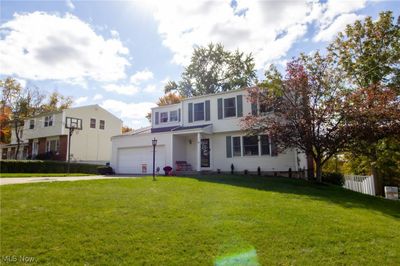 View of front of home with a front yard and a garage | Image 3