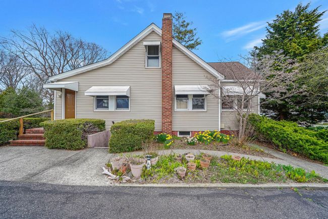View of home's exterior featuring a chimney | Image 4