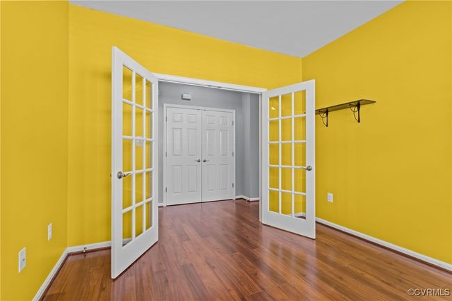 Unfurnished room featuring french doors and wood finished floors | Image 23