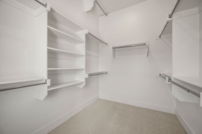 This dreamy owner's bedroom offers plenty of space and natural light. | Image 15