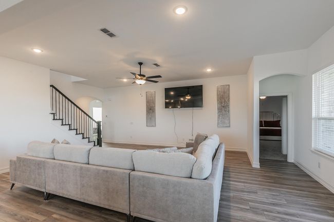 Living room with ceiling fan and wood-type flooring | Image 14