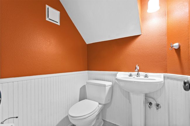 The half bathroom is located on the main floor near the living room | Image 23