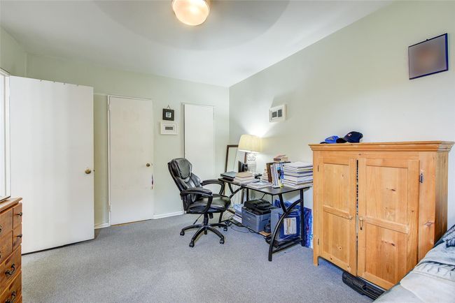 Carpeted home office featuring baseboards | Image 9
