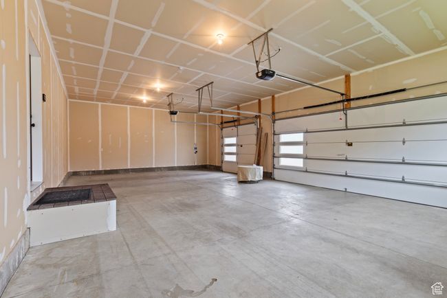 Garage with a garage door opener | Image 37