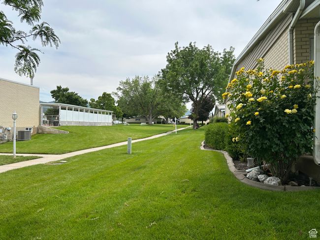 View of green lawn with cooling unit | Image 16