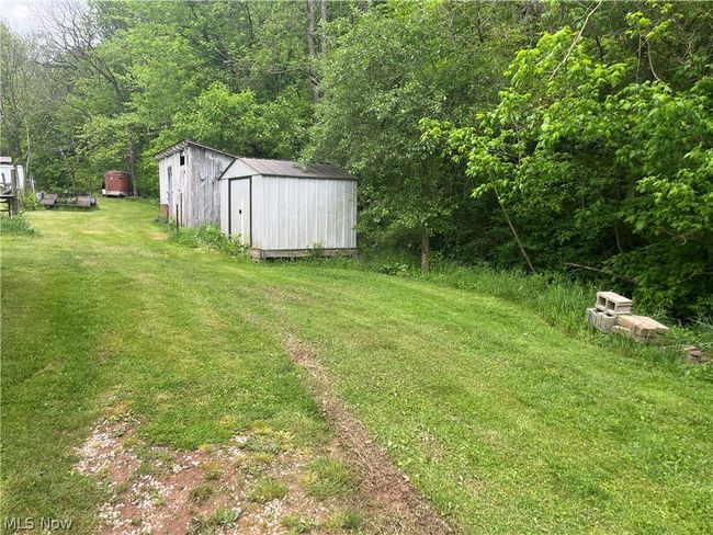 View of yard with a storage unit | Image 19