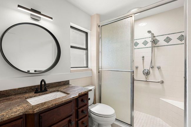 Full bathroom featuring a stall shower and vanity | Image 20