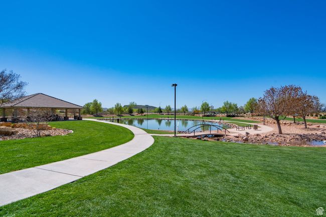 View of community featuring a lawn and a water view | Image 77