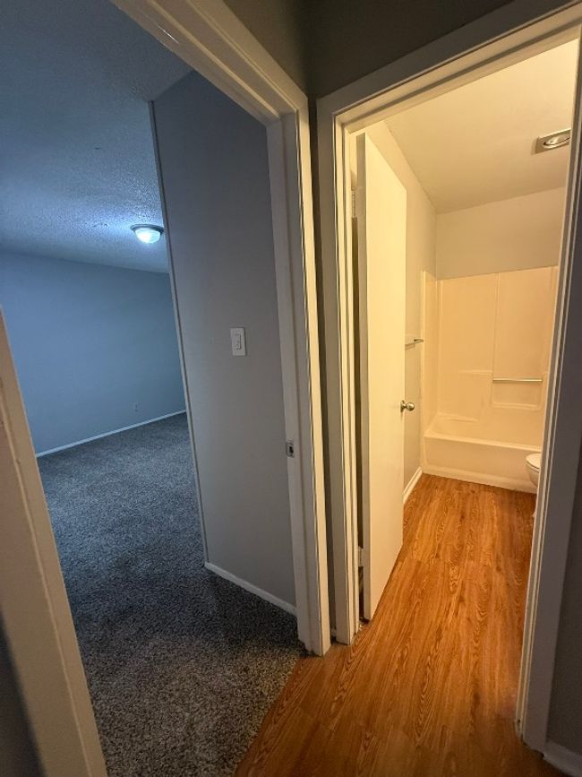 Corridor with wood finished floors and baseboards | Image 13