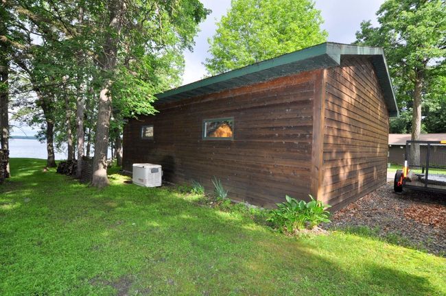 Backside of garage & whole house Generac generator | Image 58