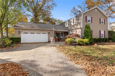 Front facade featuring a garage | Image 1